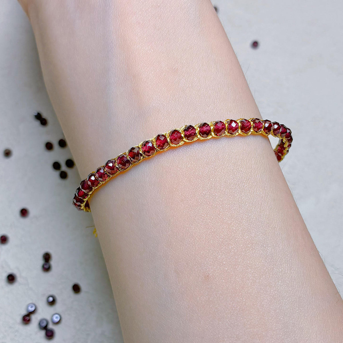 Inner Aura Awakening: Hand-Woven Gold Thread & Garnet Root Chakra Bracelet